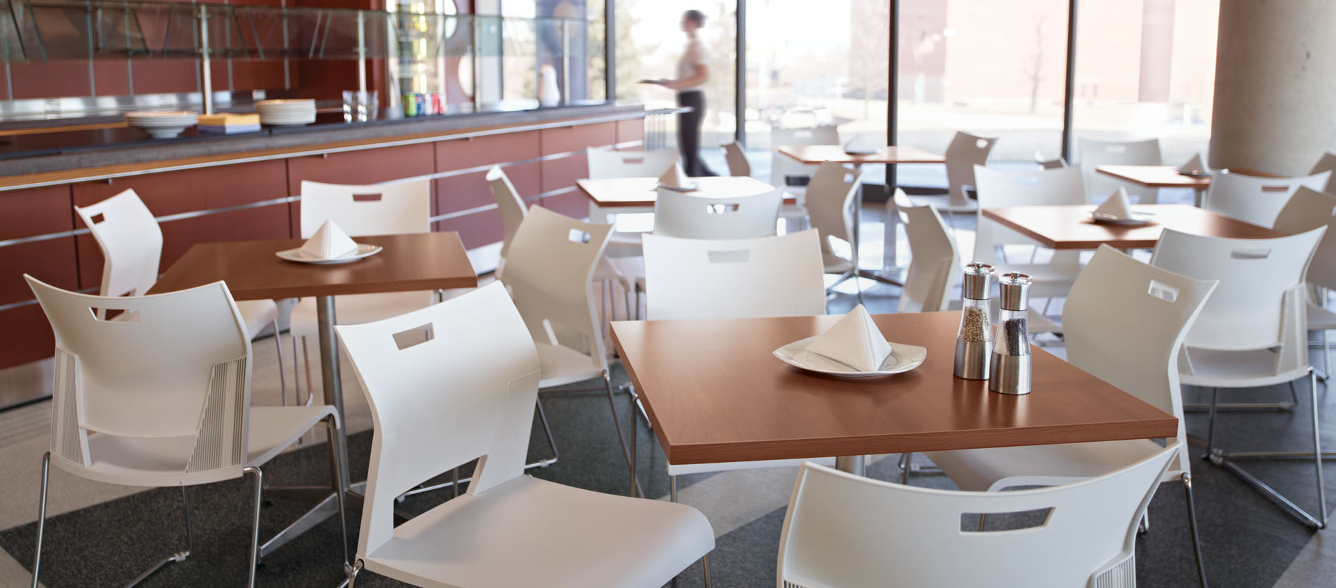 Image of cafeteria tables set in preparation for lunch